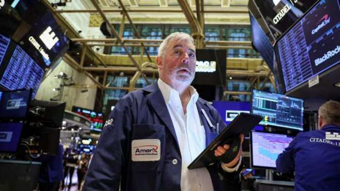 Wall Street ends slightly higher after mixed Fed statements