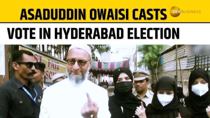  Asaduddin Owaisi casts his vote at a polling booth in Hyderabad during local elections 