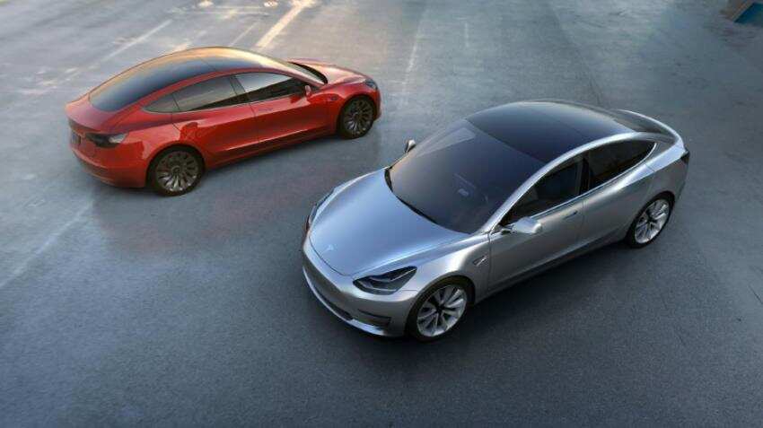 Tesla raising cash to fund accelerated production