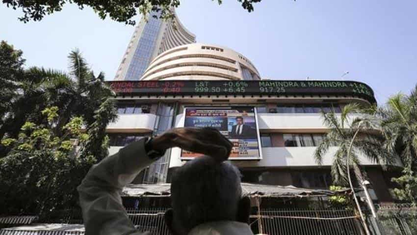 Sensex closes flat; Idea Cellular ends down 11%