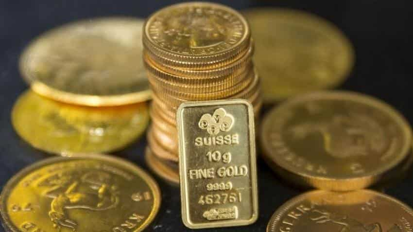 Gold hovers near 1-week low as US jobs report boosts rate-hike expectations 