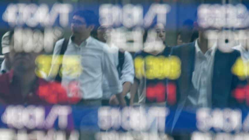 Asia stocks cautious after Fed minutes, Tokyo sinks Asia stocks cautious after Fed minutes, Tokyo sinks