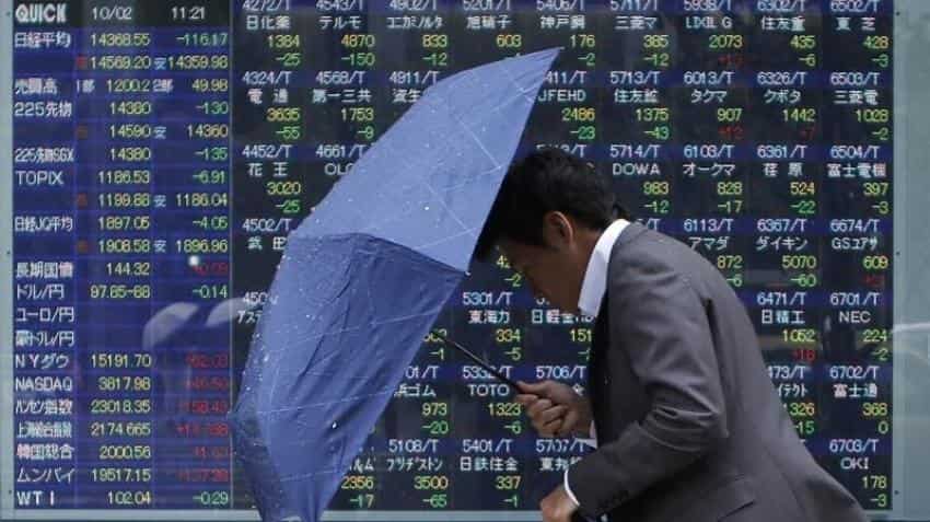 Asian shares edge up as investors await policy decision in Australia