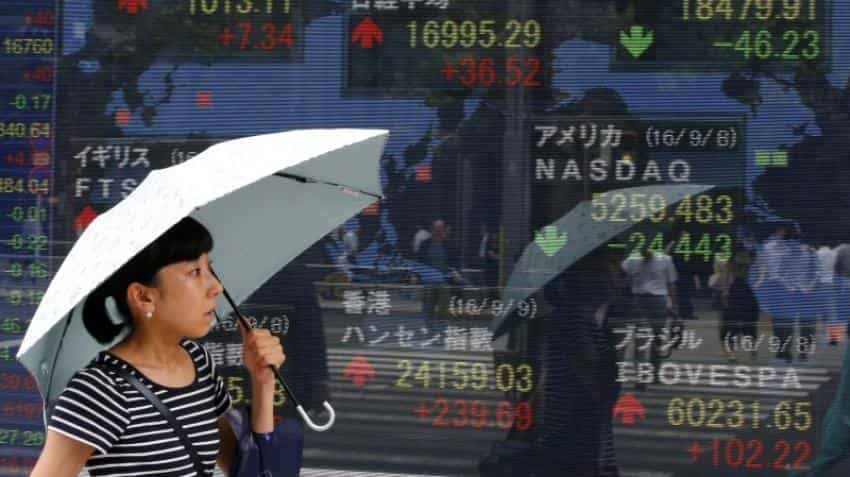 Asian markets rise before central bank meetings in US, Japan