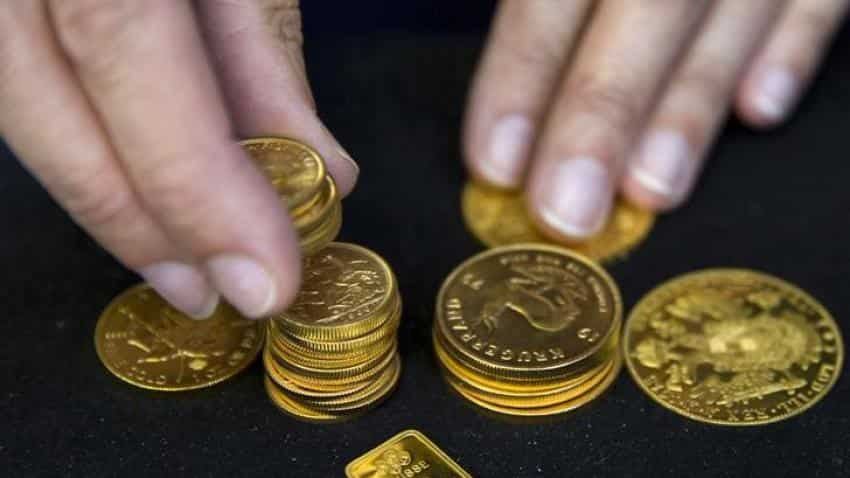 Gold edges up on short covering as Deutsche Bank concerns ease