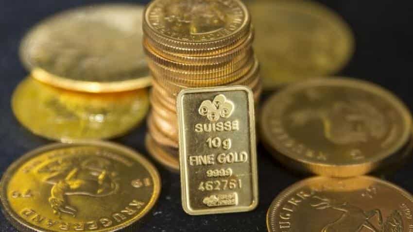 Gold treads water, possible U.S. rate hike in focus