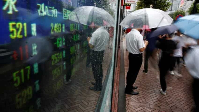 Asian stocks edge higher amid low risk appetite; oil firm