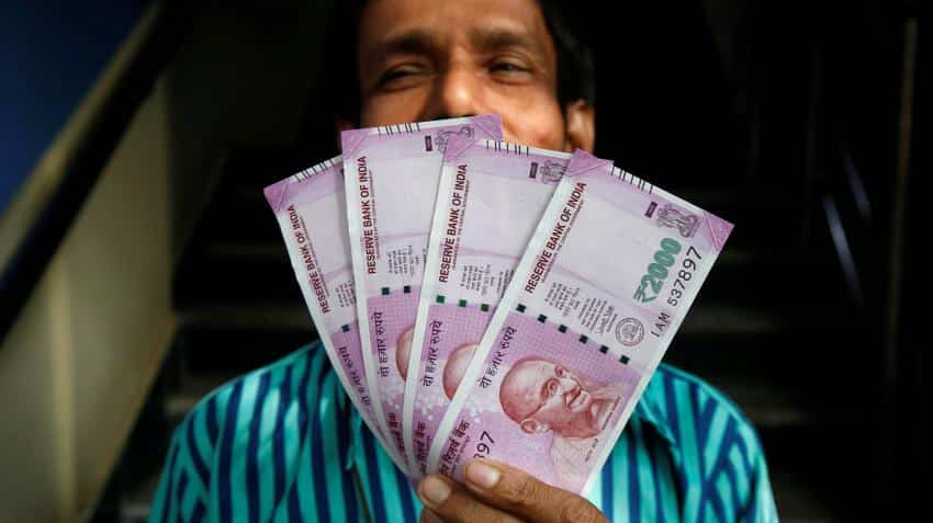 Money-changers make merry as people flock to convert black money