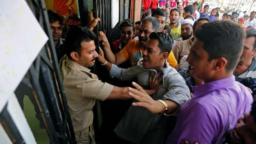 Serpentine queues, chaos outside banks on salary day