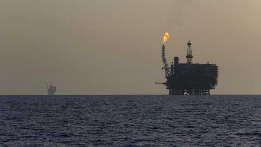Oil surges as non-OPEC, OPEC producers agree on output cuts; dollar strong