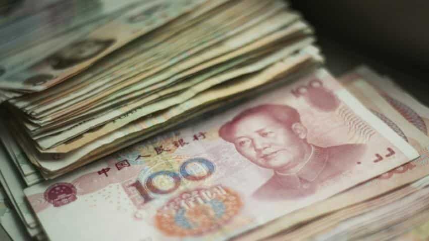 China urges calm on yuan after US rate hike