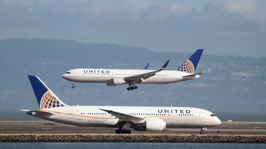 United Airlines under fire after passenger dragged from plane; officer put on leave