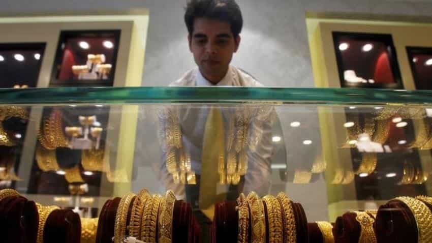 Gold slips as U.S. data lifts dollar, boosts rate hike prospects