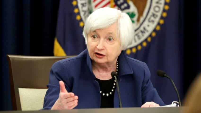 Fed raises rates, unveils cuts to bond holdings in sign of confidence