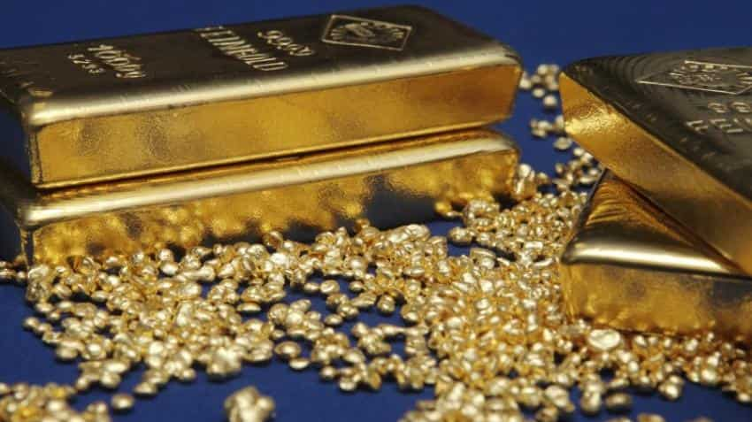 Gold edges up from five-week lows as equities fall