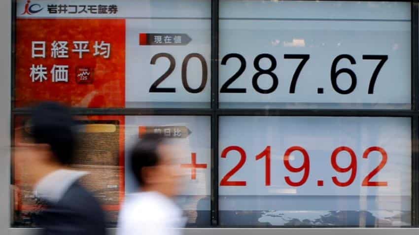Asian shares edge up, bolstered by modest gains on Wall Street