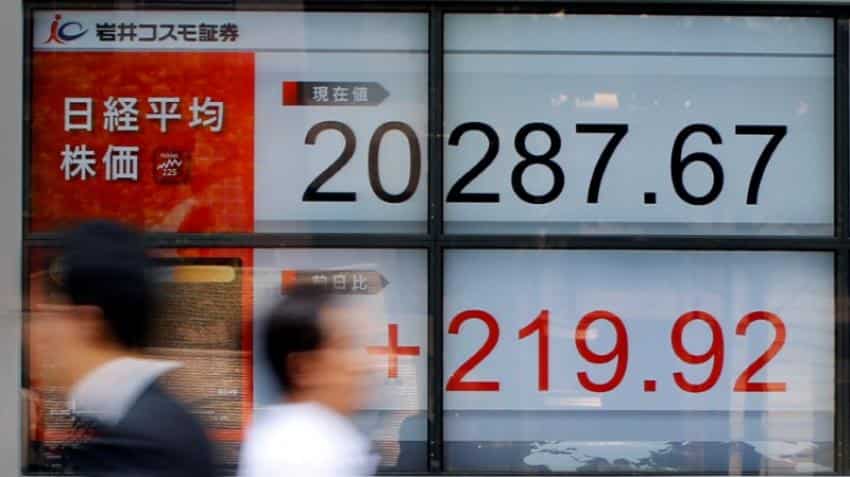 Asian markets shrug off Wall Street losses; tensions ease on Korea