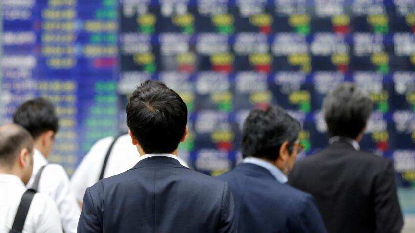 Asia stocks near decade highs on buoyant Wall Street, kiwi rallies