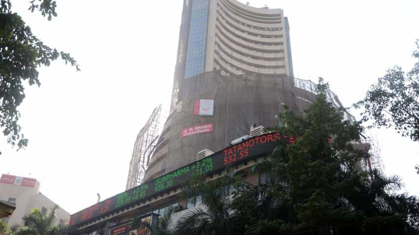 Markets trade flat, Sensex dips over 60 points