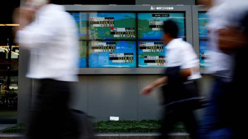 Global Markets: Asian shares gain as earnings, tax debate help U.S. stocks