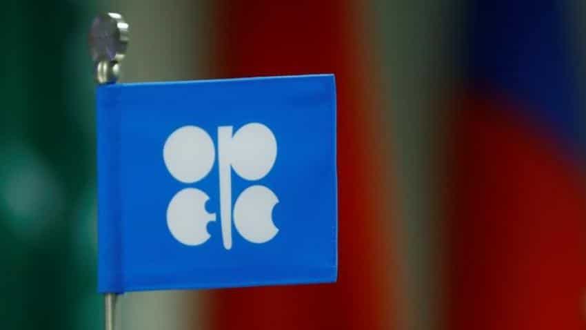 US oil dips on increased drilling, but OPEC cuts support global markets