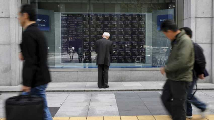 Asian shares subdued as tech blues offset U.S. tax cut hopes