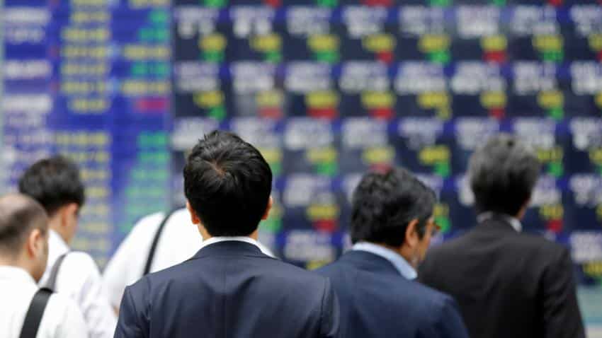 Asia shares hover near two-month low as growth, US policy risks sap sentiment