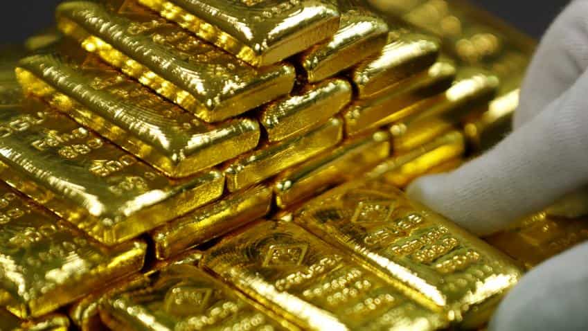 Gold hits over four-month high as dollar index slumps to three-year lows