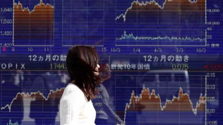 Global Markets: Asian shares dip as commodities ease, bitcoin licks wounds
