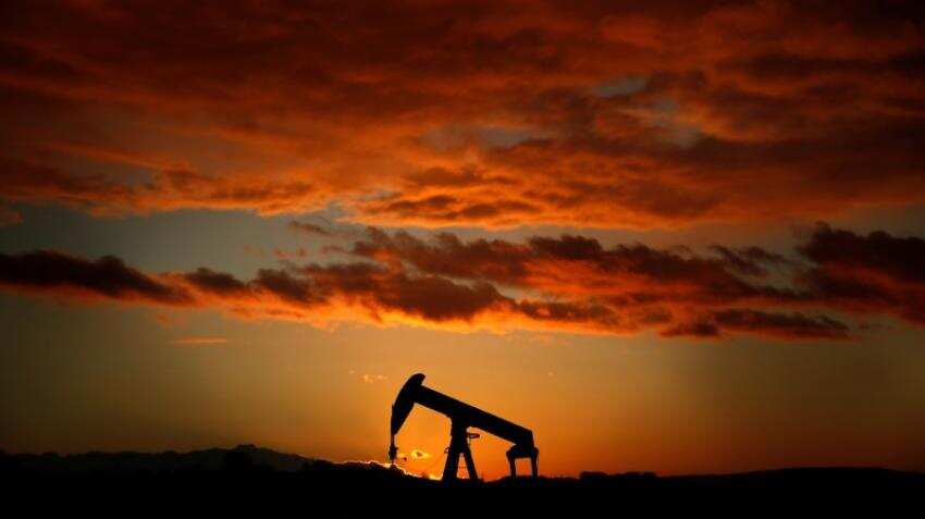 Oil falls below $69 as stronger dollar dents risk assets