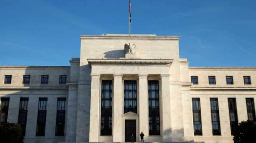 US Fed leaves rates unchanged, sees inflation rising this year
