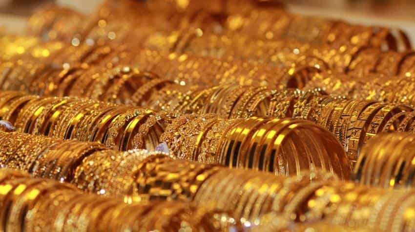Yellow metal price tumbles in India; Spot gold edges up
