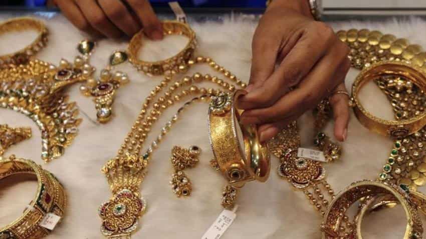 Gold rises on U.S.-China trade negotiations despite firmer dollar Gold rises on U.S.-China trade negotiations despite firmer dollar