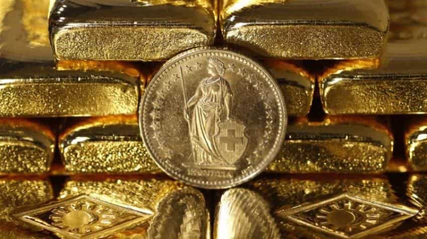Gold steady as strong dollar counters concerns over US-China trade spat Gold steady as strong dollar counters concerns over US-China trade spat