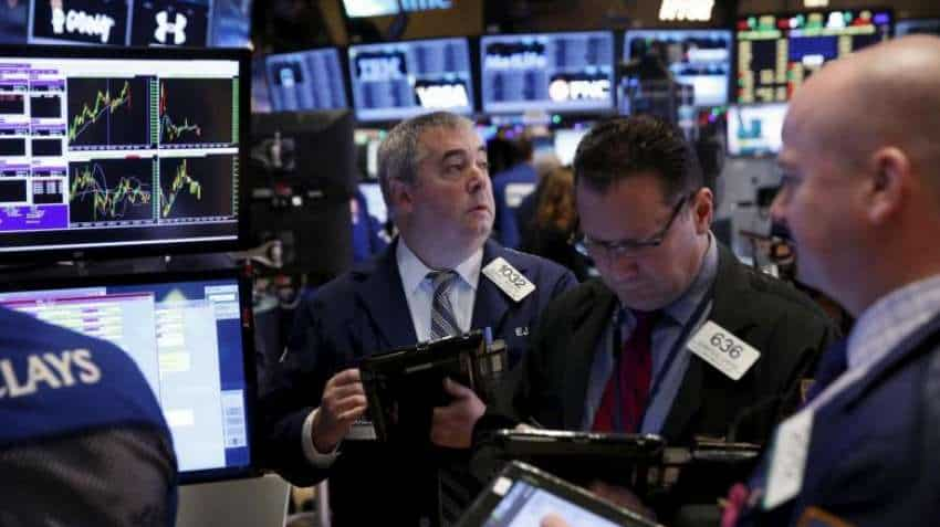 Wall Street settles lower as fall in Amazon, Intel share prices add to trade jitters