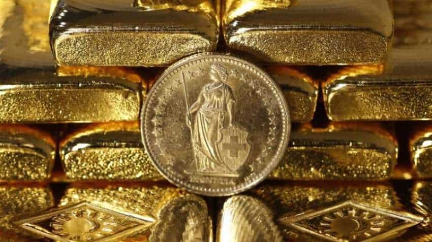 Gold prices recover from 6-month low as dollar drops; Russia buys bullion