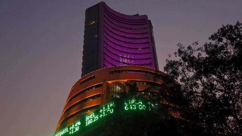 Sensex surrenders big gains, closes 35,490 pts, up by just 19.69 points