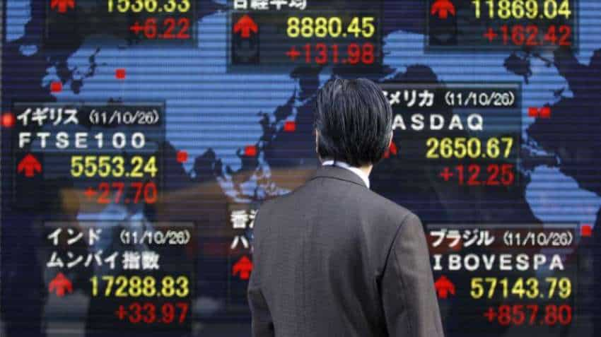 Asian markets flirt with nine-month low on mounting trade war fears