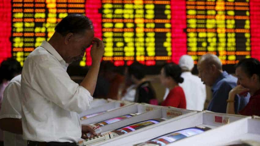 Sliding yuan hits world stock markets, stokes trade war fears