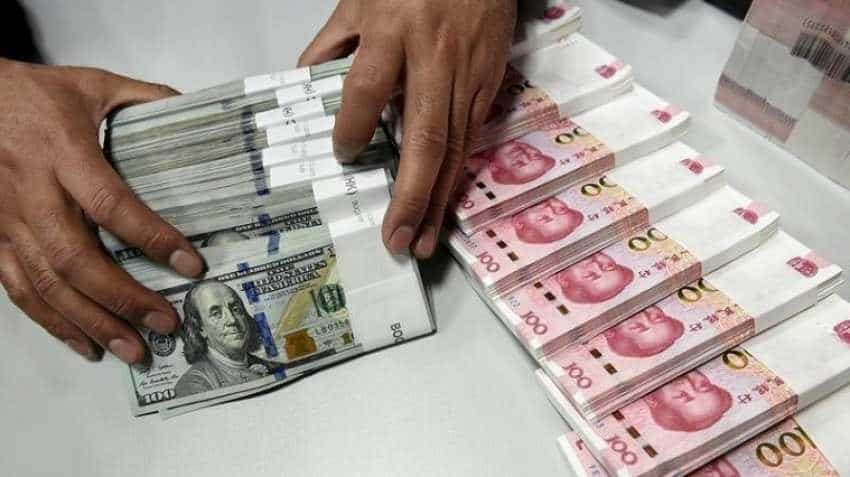 China&#039;s yuan edges lower against US dollar