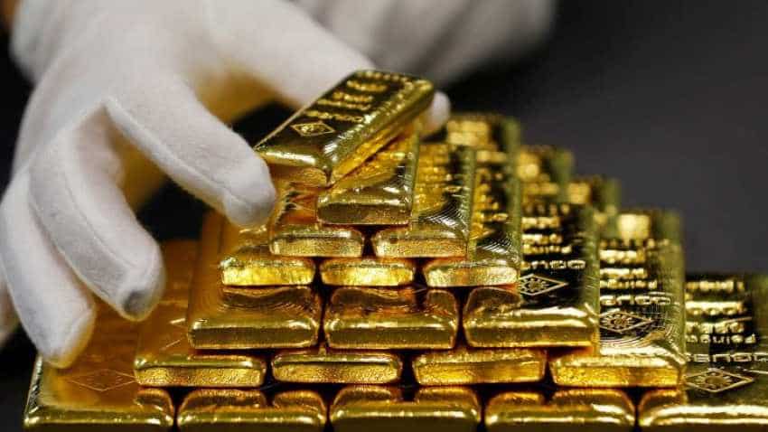 Gold prices near one-week high on subdued dollar, equities Gold prices near one-week high on subdued dollar, equities