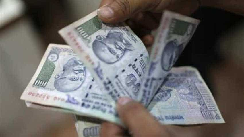 Rupee slips 23 paise to 69.85 against US dollar on fund outflows