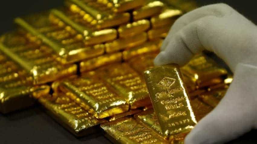 Gold prices ease as dollar bounces back from multi-week lows