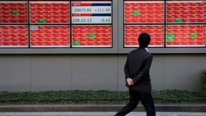 Global Markets: Asia shares dip, dollar gains on weak sterling