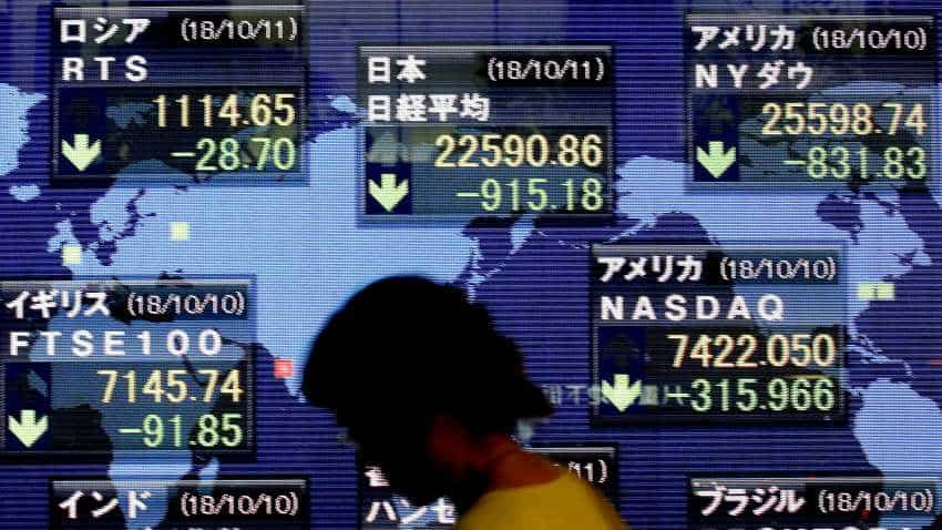 Global Markets: Asia stocks higher ahead of Fed rate cut, pound pressured by fresh Brexit pain