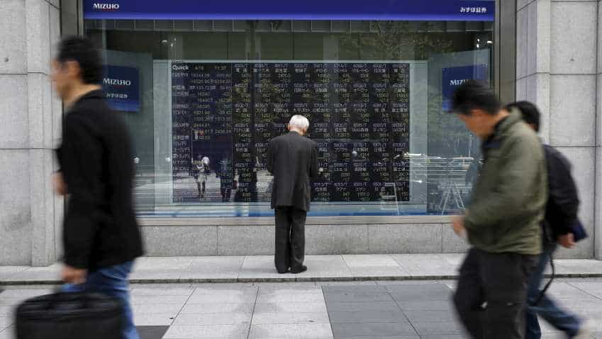 Global Markets: Asian shares on track for weekly loss amid mounting US political uncertainties
