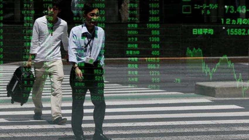 Asian shares track modest global gains, sterling lower Asian shares track modest global gains, sterling lower