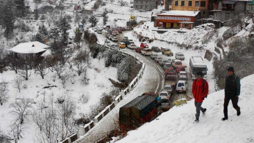 Weather today: Hills overlooking Manali, Himachal Pradesh wrapped in snow