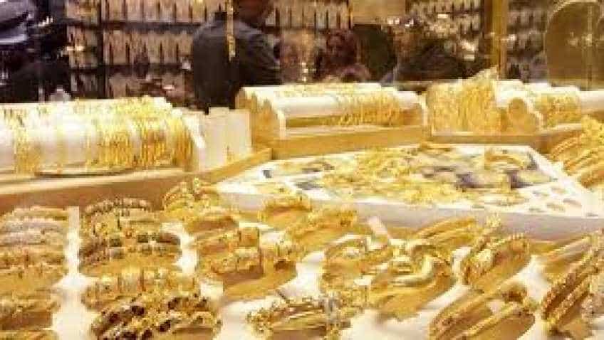 Gold price eases as stocks gain; set for best weekly jump in over four months