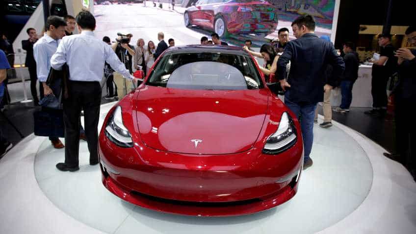 Tesla begins deliveries of China-made Model 3 cars